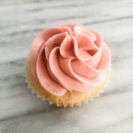 Cupcake with pink Swiss meringue buttercream
