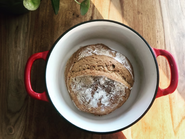 Gluten Free Sourdough Bread Loaf of gluten free bread in a red Dutch oven