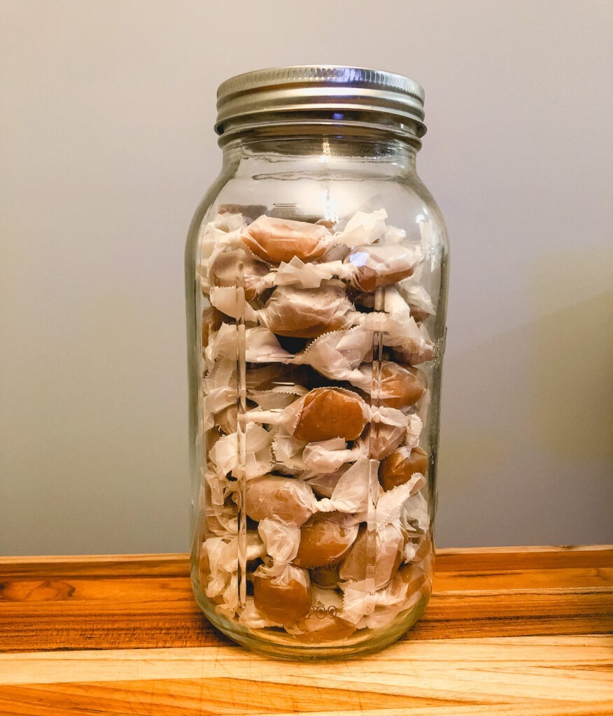 Chewy caramels in a large mason jar
