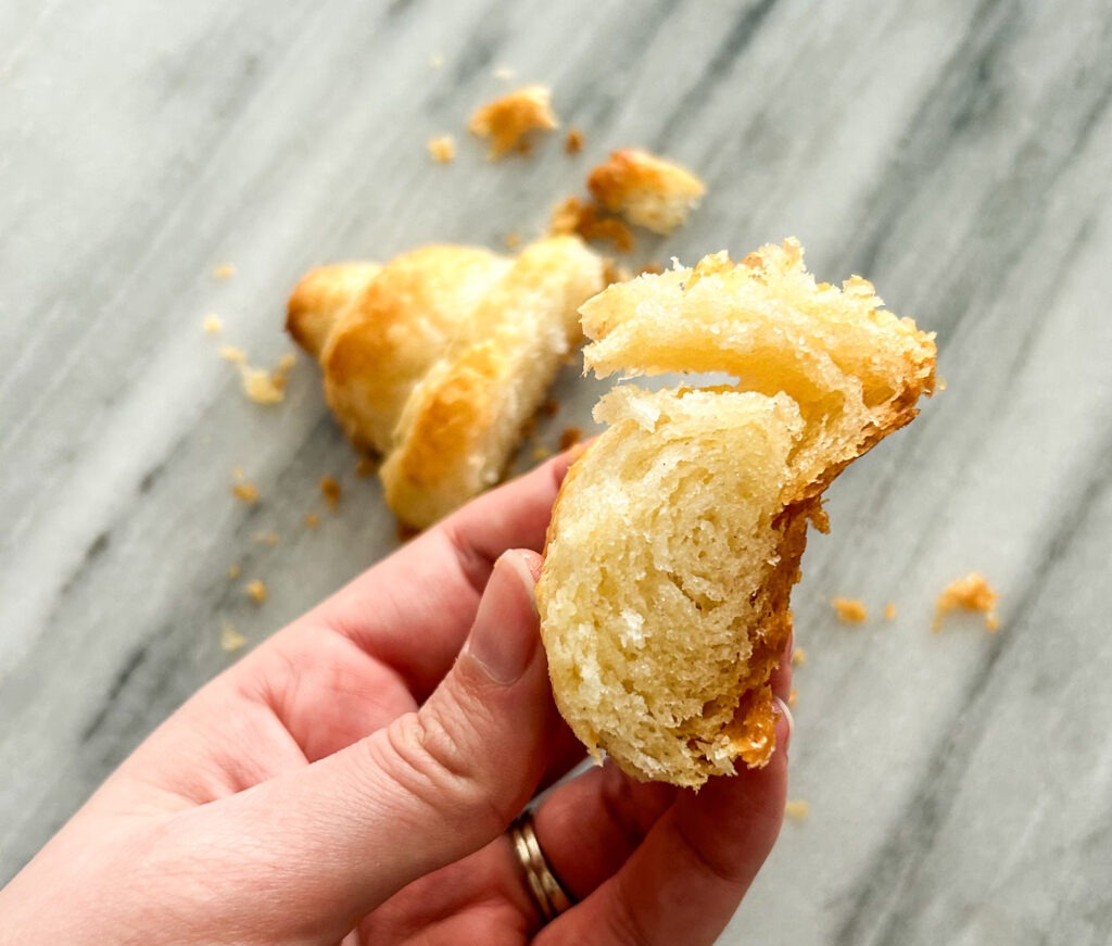 Showing the inside of a gluten free croissant and all the layers