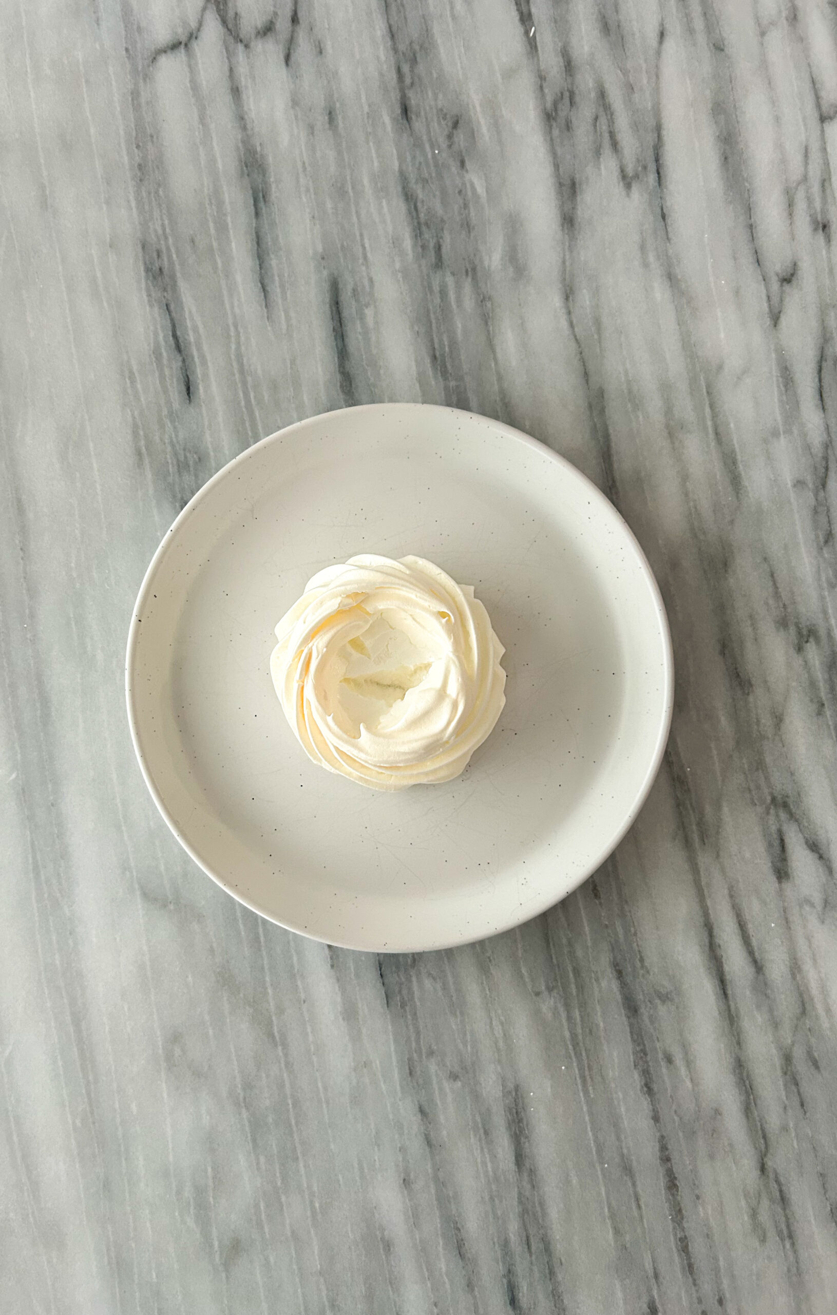 Mini pavlova with a well in the Center for filling